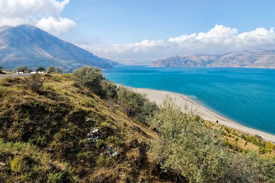 Charvak Reservoir and mountain slopes in the Chimgan and Bostanliq area
