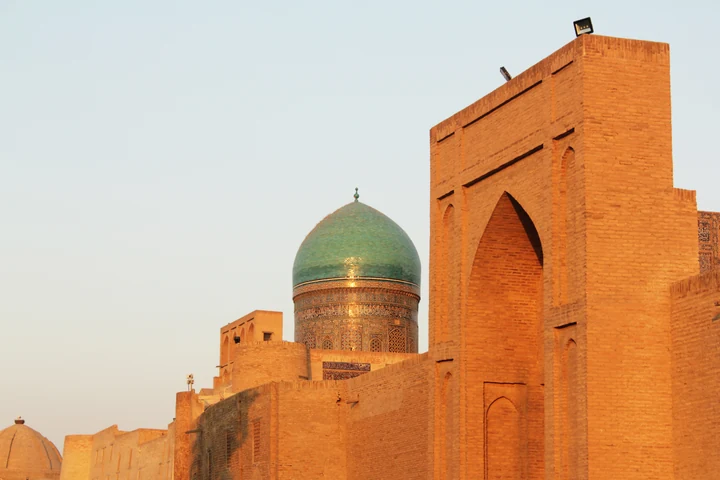 Dome and portal of the Po-i-Kalyan ensemble in Bukhara at sunset