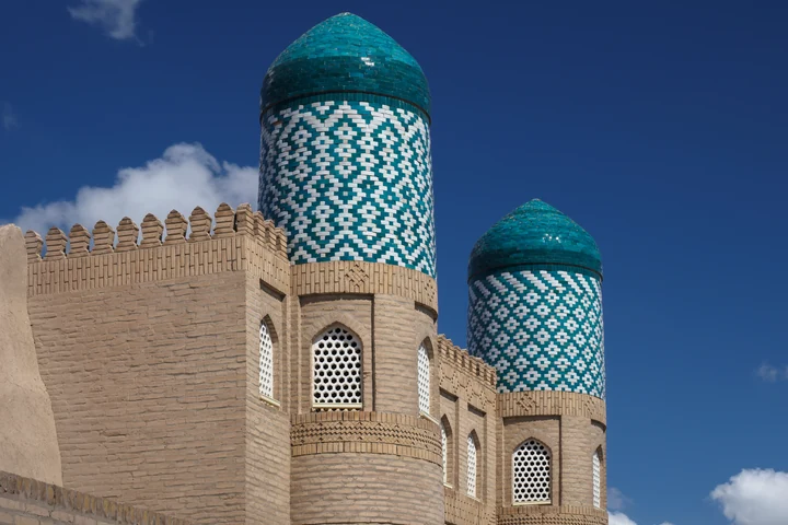 Turquoise-tiled towers of the Kunya-Ark citadel in Itchan Kala, Khiva