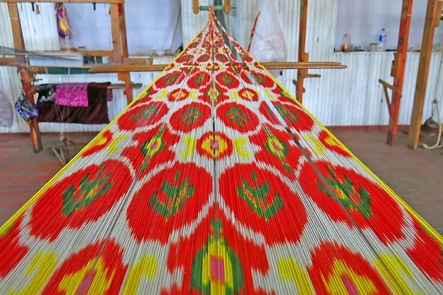 Silk fabric being woven on a loom in Margilan, Uzbekistan